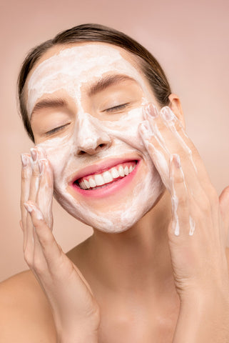 Woman washing face