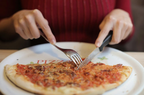 Person eating whole pizza