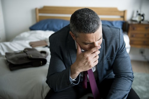 Image of man crying wearing a suit