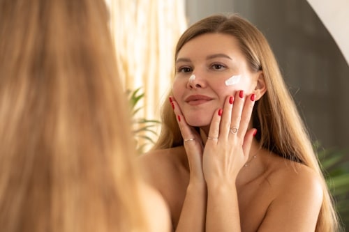 Woman putting DIY face cream