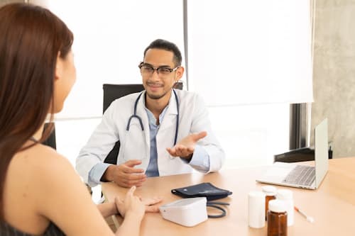 Consulting a doctor to have medicine dosage adjusted