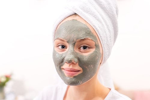 Woman with clay mask