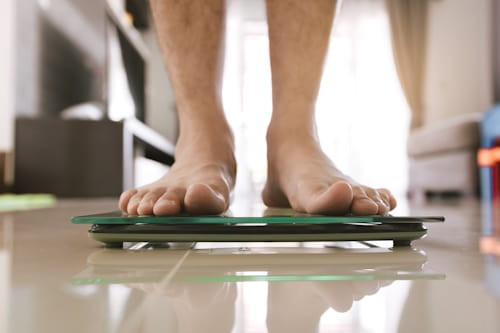 Person standing on a weighing scale