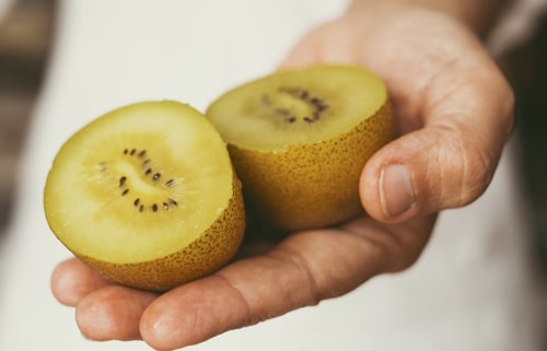 Close up of sun kiwi vitamin fruit cutted in two 