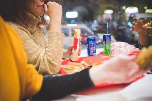 Teens eating fast food and other junk foods