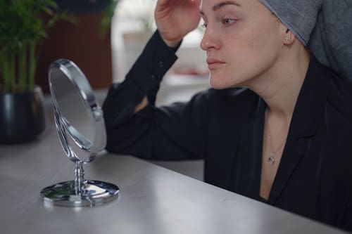 Woman getting estrogen treatment for her acne