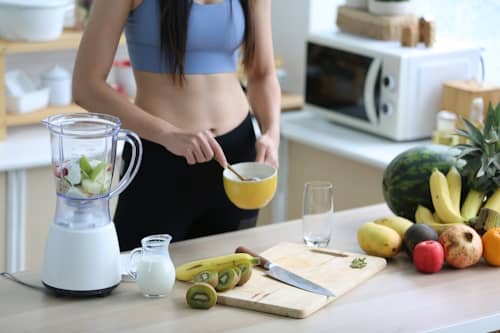 Fit woman preparing a healthy meal