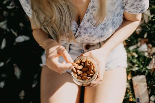 Woman eating almonds