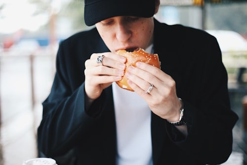 Man eating burger