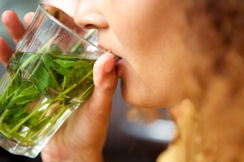 Woman drinking homemade spearmint tea