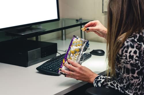 Eating junk foods while watching shows on a computer