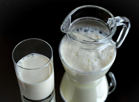 Milk in glass and pitcher.