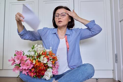 Senior woman undergoing menopausal symptoms