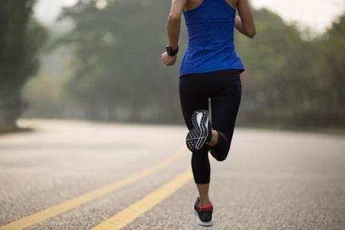 Woman jogging wearing blue