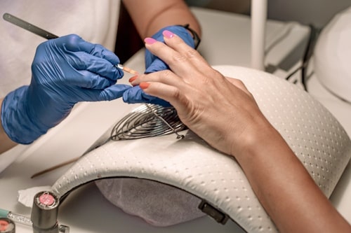 Pretty hands being manicured by a professional