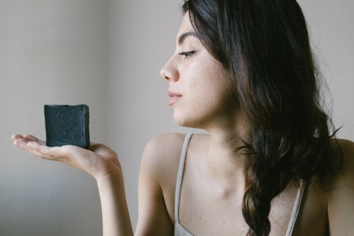 Woman holding an African Black Soap