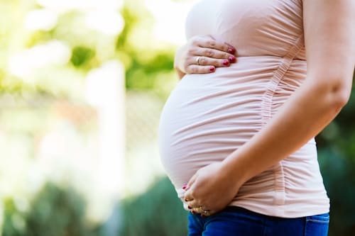 Pregnant woman wearing pink