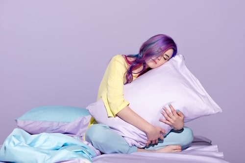 Woman hugging silk pillow