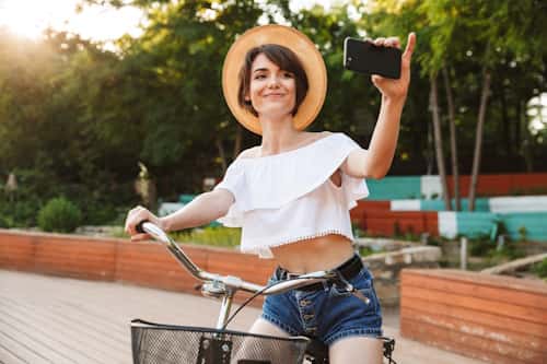 Woman taking a selfie wearing loose clothes