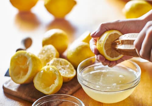 Person making lemon juice