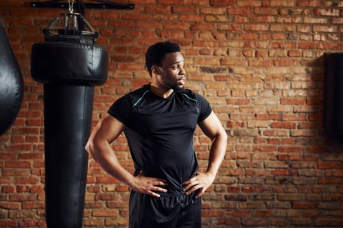 Strong african american man in tight sportive clothes 