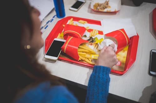 Table of people eating fast food fries