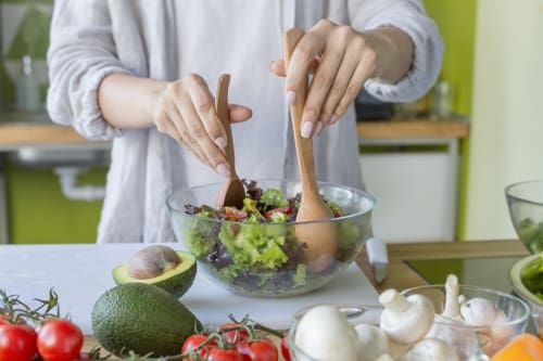 Woman on healthy diet of organic green vegetables