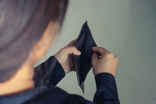 Woman worried beacuse her wallet has no money