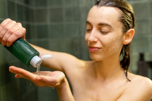 Woman about to take a shower before sleeping