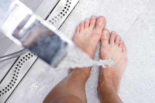 Image of person washing their feet