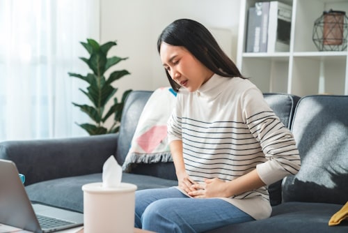 Woman having a PCOS cramp