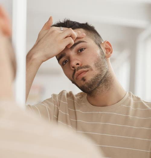 Man looking in mirror