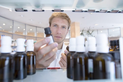 Man picking skin care products