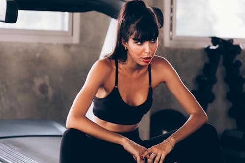 Woman exercising in gym with tight clothes