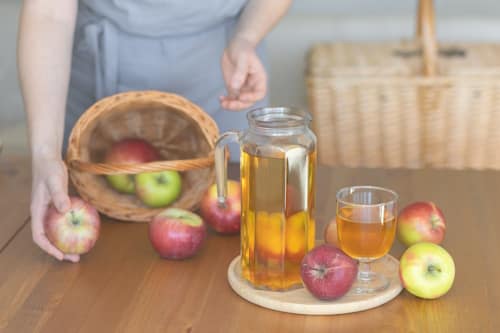 Apples and apple cider on a table