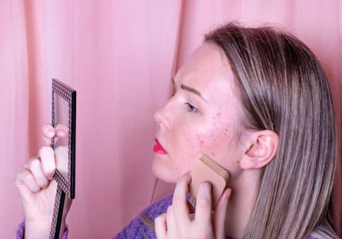 Woman putting make up worried about skin oil