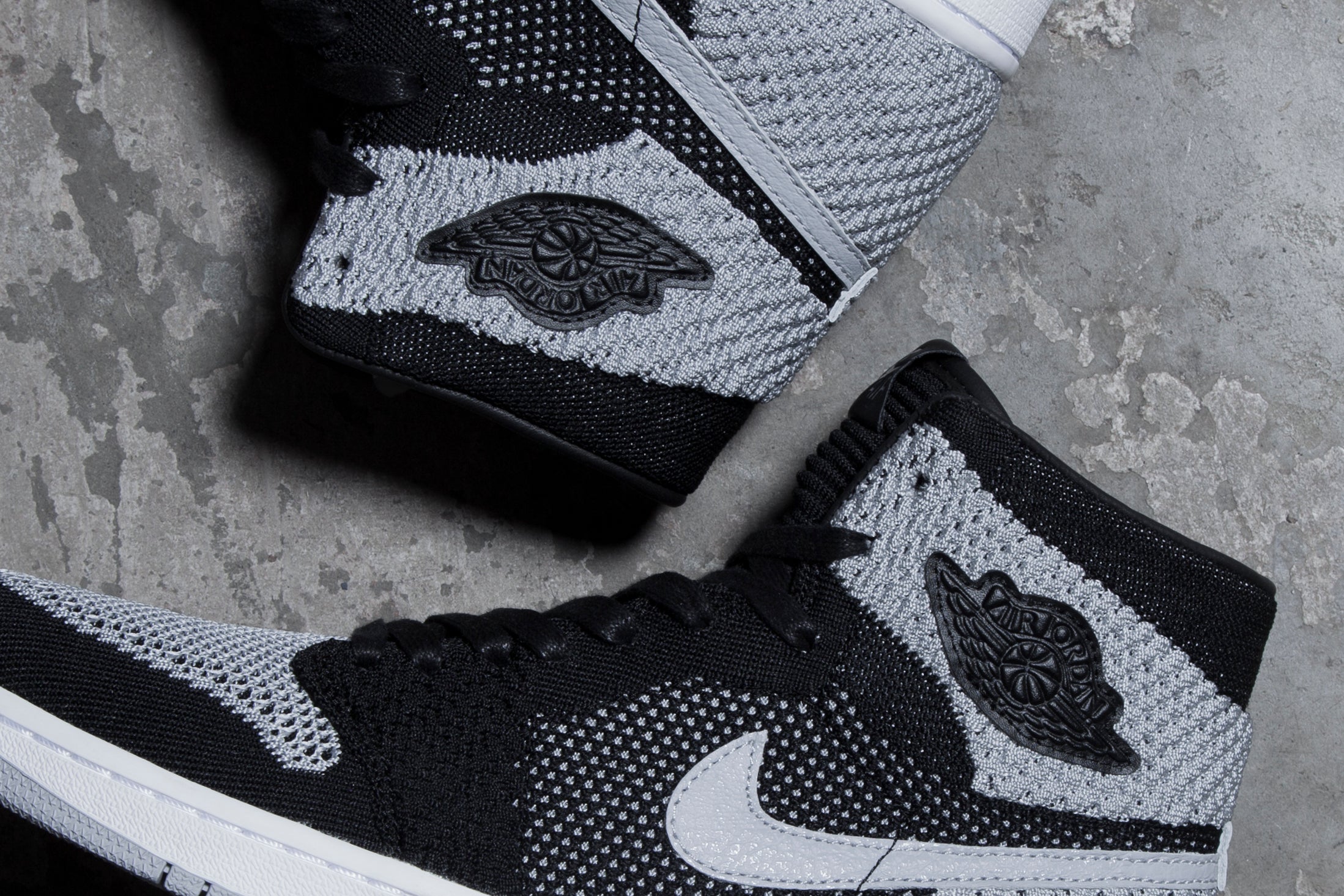 JORDAN 1 RETRO HIGH FLYKNIT BLACK / WOLF GREY