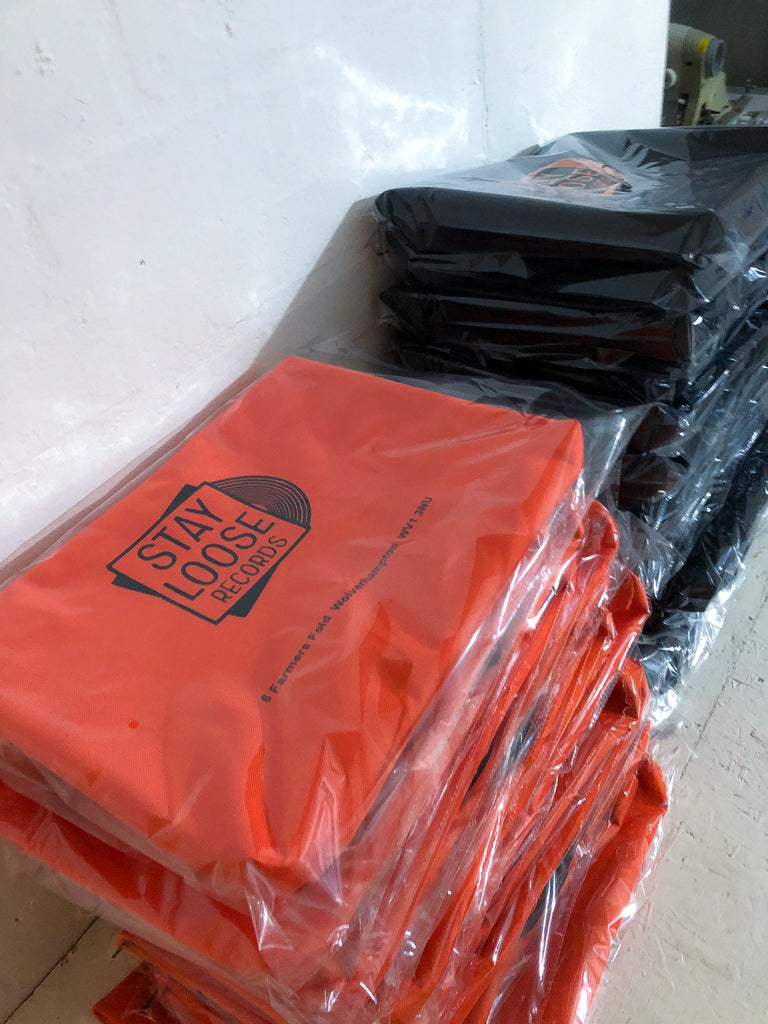 packaged tote bags made for record store