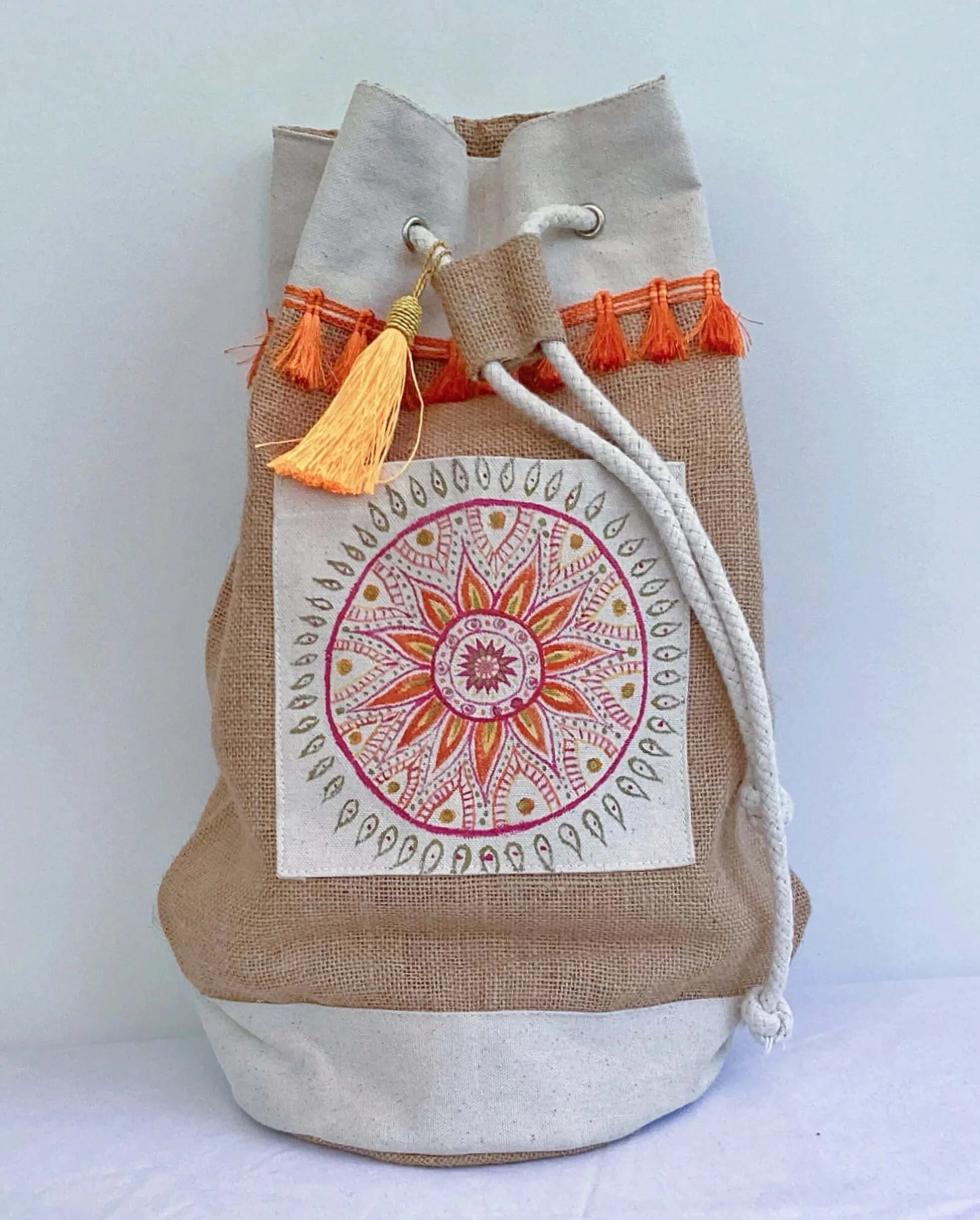 red and orange mandala satchel with button to navigate to accessories.