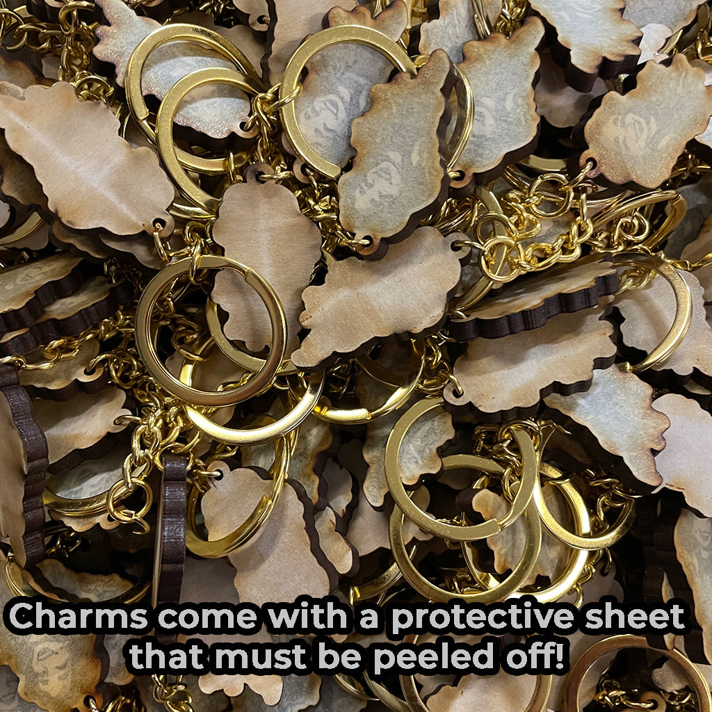 Charms include a protective film that must be peeled off!