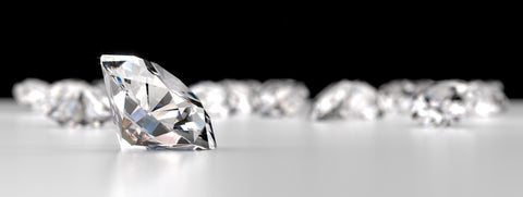 Diamonds laying on a white granite counter