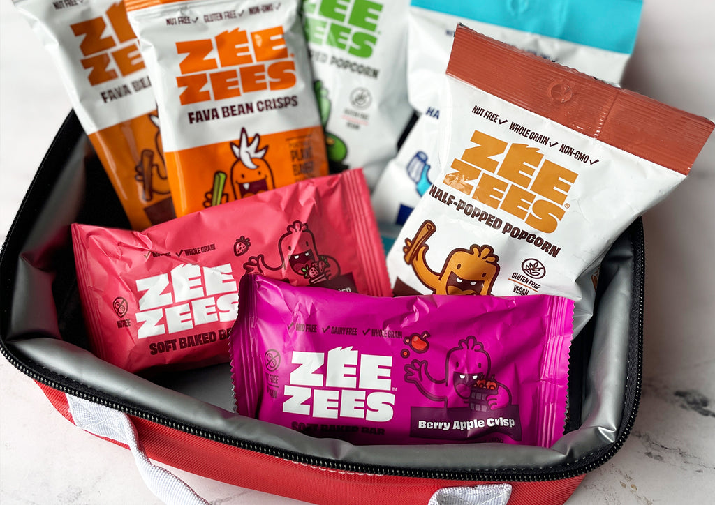 Zee Zees lunchbox with soft baked bars, half-popped popcorn and fava bean crisps