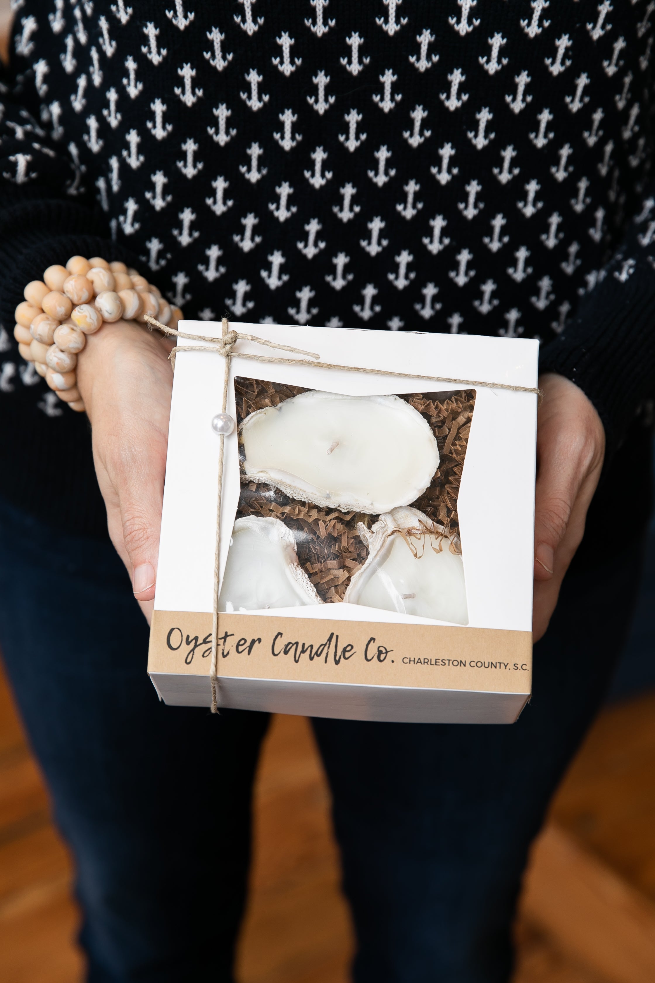 Woman holding gift box with candles from Oyster Candle Company