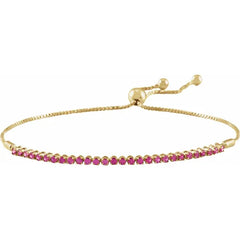 14K Yellow Gold Natural Ruby Bolo Adjustable Bracelet. Set with 28 natural rubies a part of Jewels of St Leon's Colour of the Year Collection.