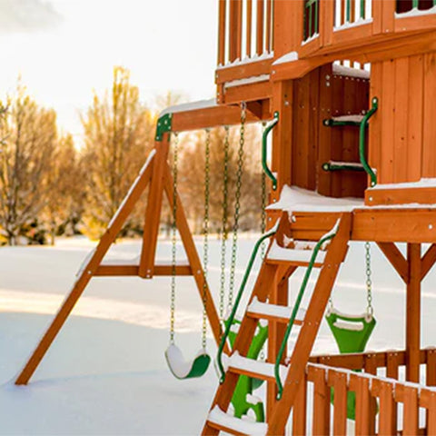 wooden swing set in winter