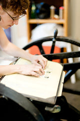 Old time letter press printing on coffee bags.