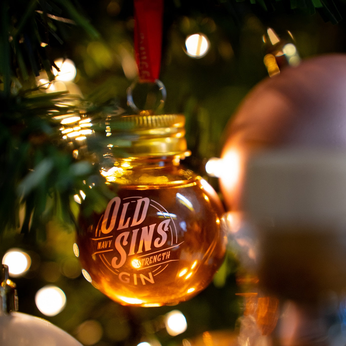 Gin bauble hanging in a Christmas Tree