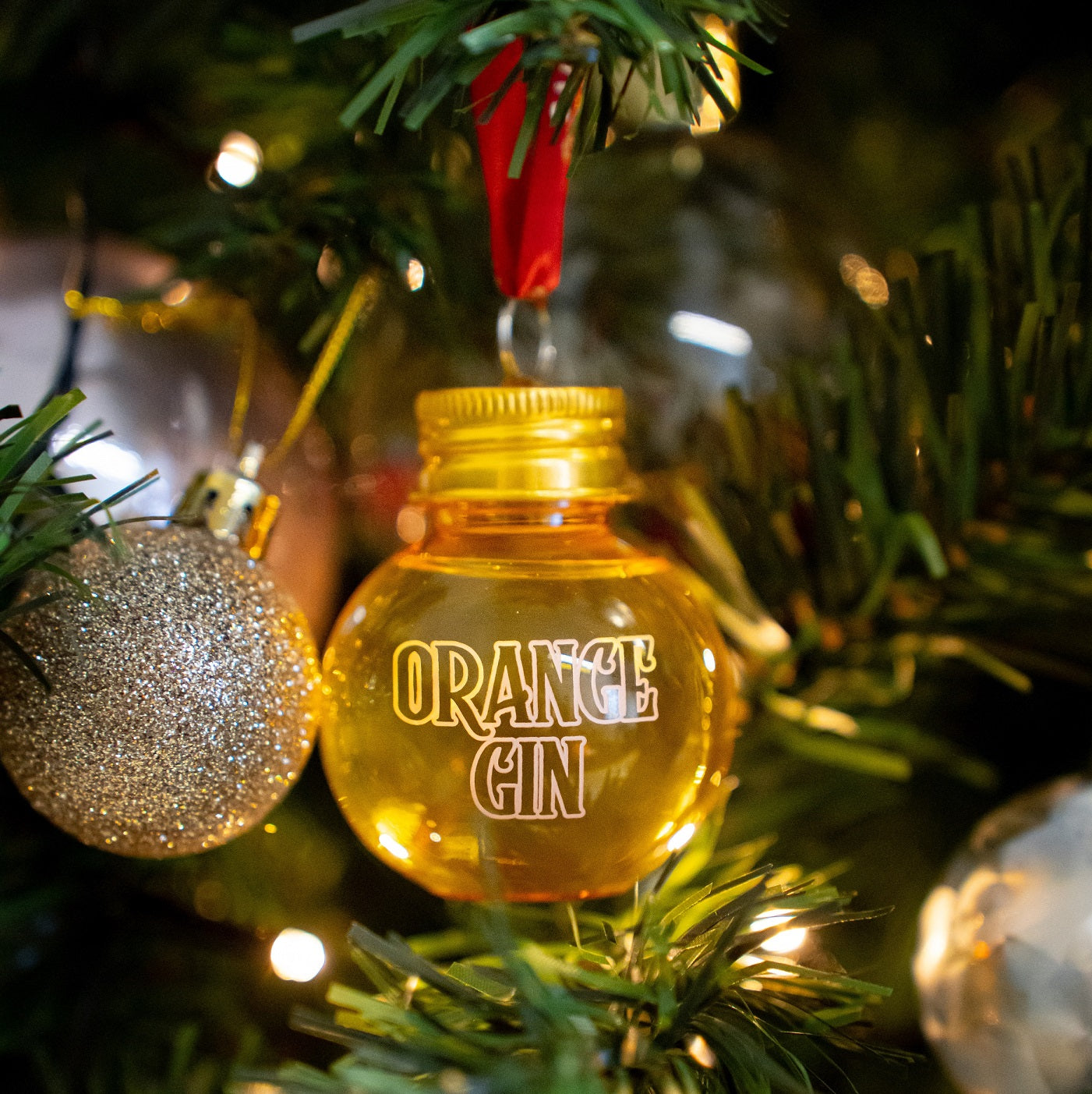 Christmas gin bauble hanging from tree