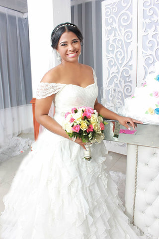 bride with off the shoulder neckline dress