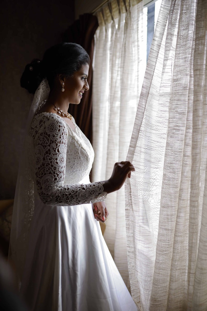 This elegant wedding gown features a Christian sheath design in  champagne-colored Net and santoon material. It boasts a fully handworked  ... | Instagram